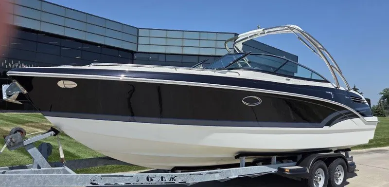  Yacht Photos Pics 2016 Formula 290 Bowrider boat on trailer, sleek design, parked outdoors.