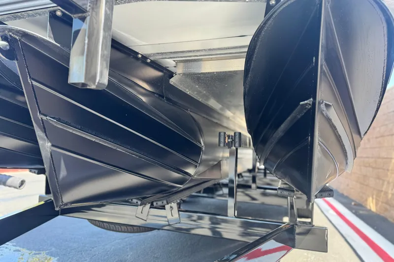  Yacht Photos Pics Underneath view of 2026 Manitou Explore Dual Engine boat hulls.