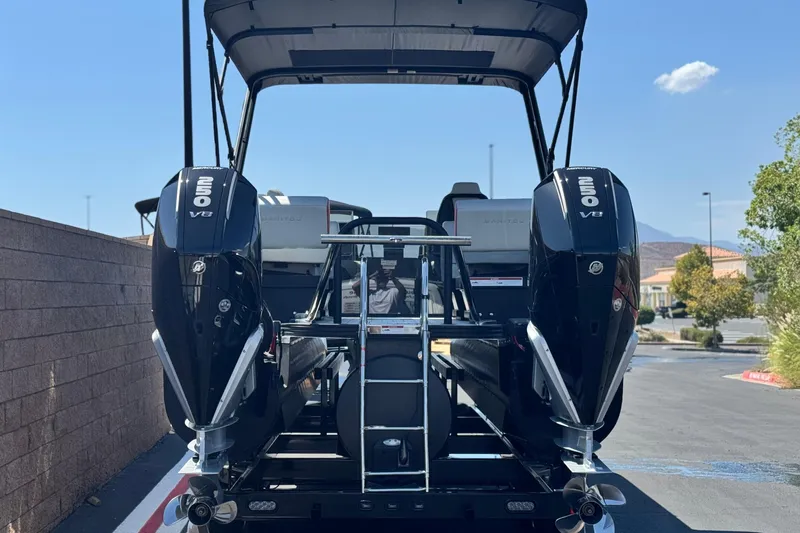  Yacht Photos Pics 2026 Manitou Explore Dual Engine boat with twin 250 V8 engines, rear view.