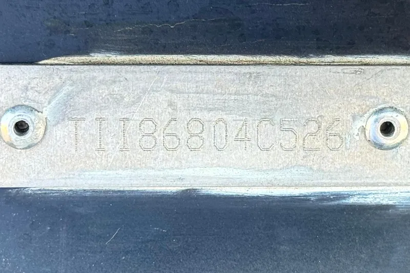  Yacht Photos Pics Serial number plate of 2026 Manitou Explore Dual Engine vehicle.