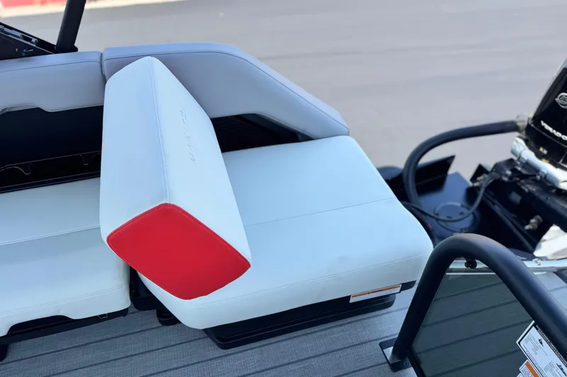  Yacht Photos Pics 2026 Manitou Explore Dual Engine boat seat with red accent and visible engine.