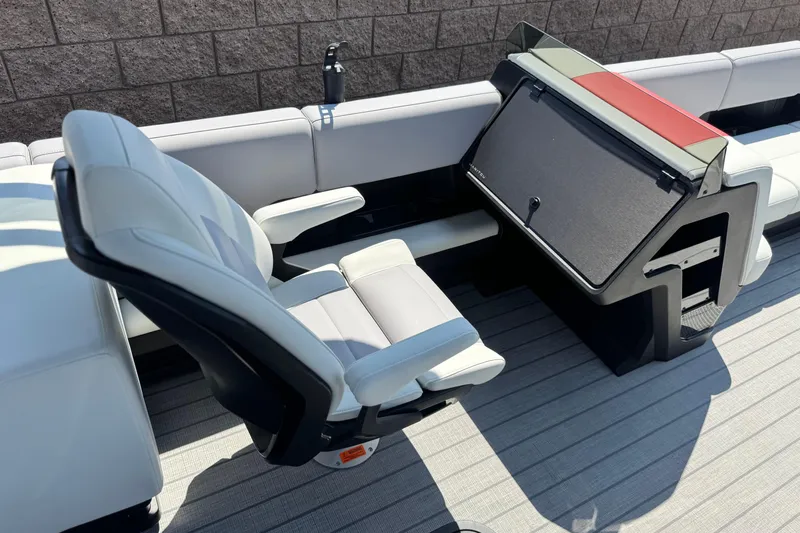  Yacht Photos Pics Luxurious seating on 2026 Manitou Explore Dual Engine boat, featuring modern design and comfort.