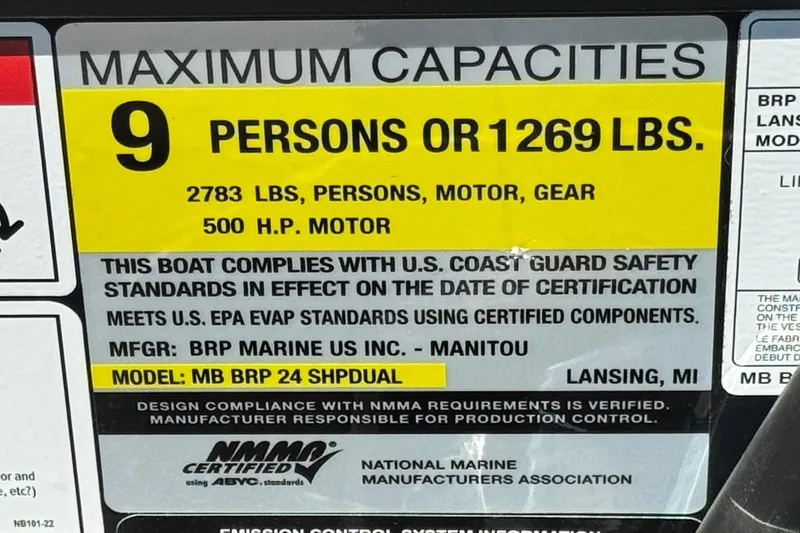  Yacht Photos Pics 2026 Manitou Explore Dual Engine boat capacity label, 9 persons or 1269 lbs, 500 HP motor.