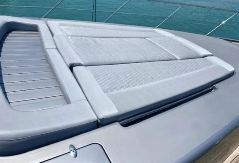  Yacht Photos Pics Sunbathing deck on 2004 Azimut 86S yacht, featuring cushioned seating and sleek design.