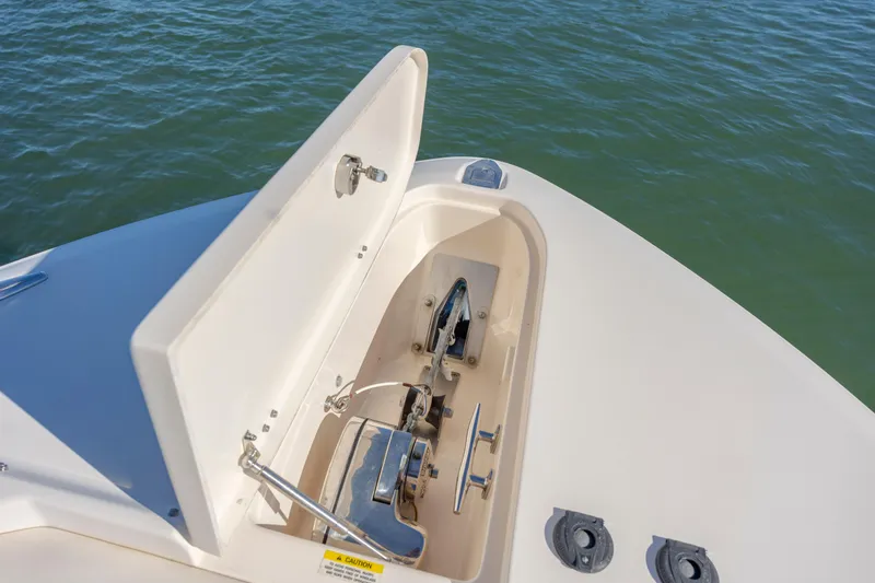  Yacht Photos Pics 2020 Grady-White Freedom 307 boat anchor compartment open on calm water.