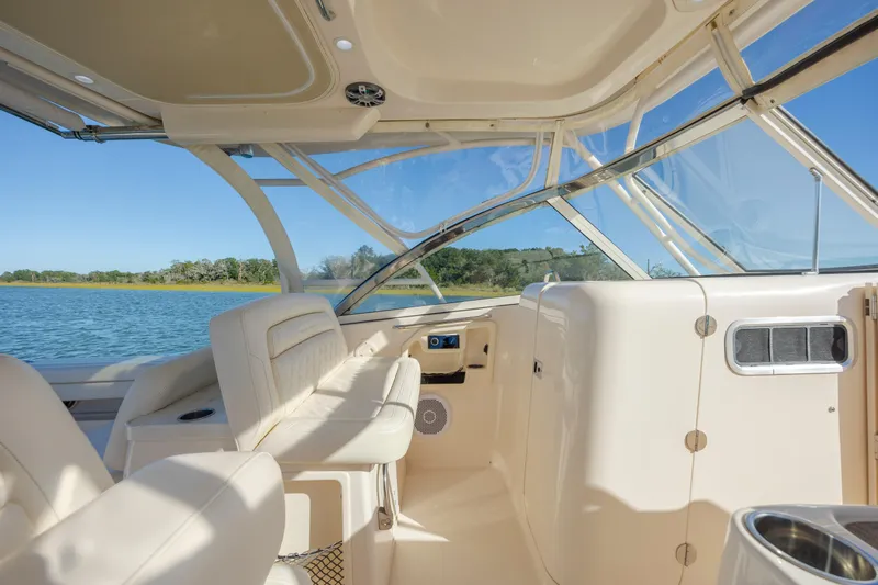  Yacht Photos Pics 2020 Grady-White Freedom 307 boat interior with seating and water view.