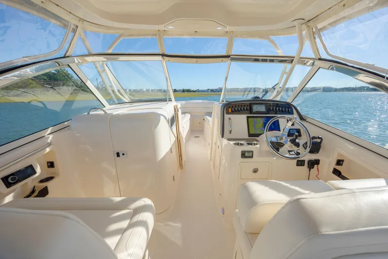  Yacht Photos Pics 2020 Grady-White Freedom 307 boat interior with steering wheel and navigation system.