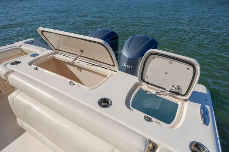  Yacht Photos Pics 2020 Grady-White Freedom 307 boat with open storage compartments and twin Yamaha engines.