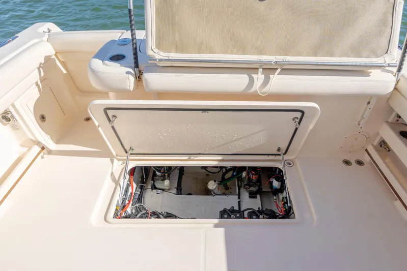  Yacht Photos Pics 2020 Grady-White Freedom 307 boat interior with open hatch revealing wiring and components.