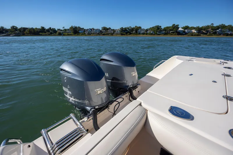  Yacht Photos Pics 2020 Grady-White Freedom 307 boat with dual Yamaha 300 engines on a calm lake.