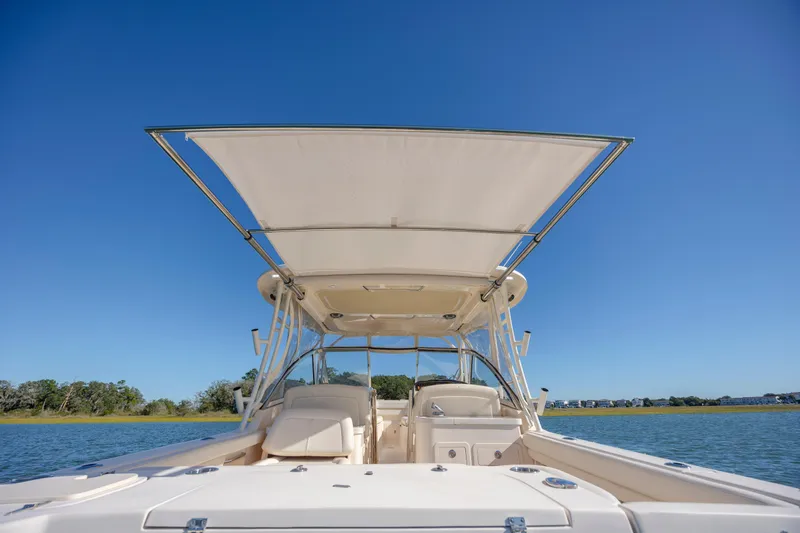  Yacht Photos Pics 2020 Grady-White Freedom 307 boat on water under clear blue sky.
