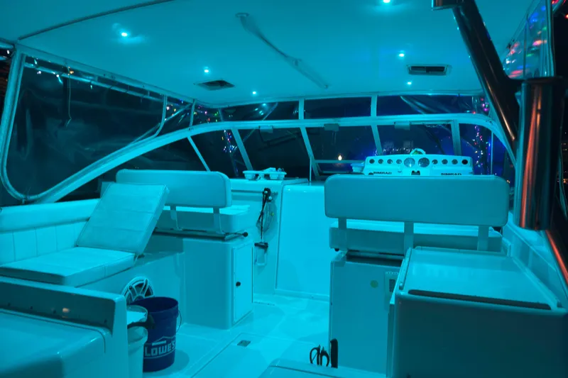 Island Oasis Yacht Photos Pics Interior of 2001 Cabo 35 Express boat with blue ambient lighting.