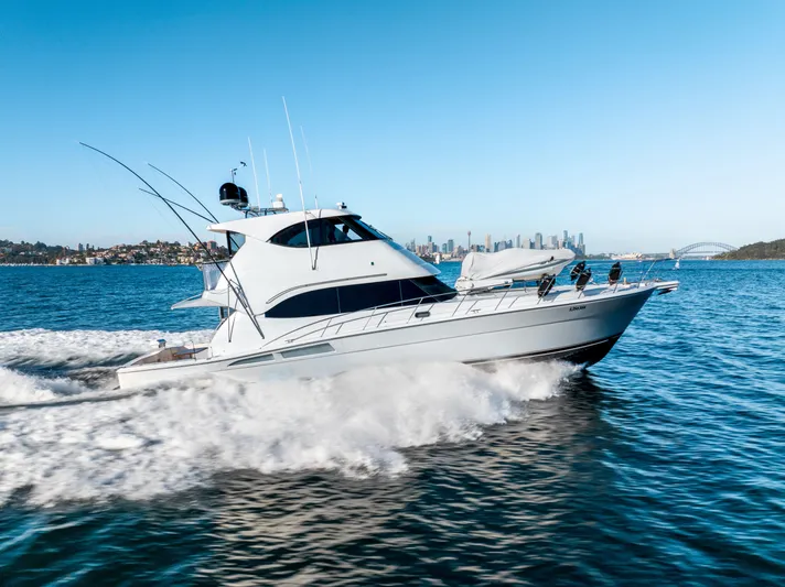 Riviera 61 Enclosed Flybridge Yacht Photos Pics 2011 Riviera 61 Enclosed Flybridge yacht cruising on open water.