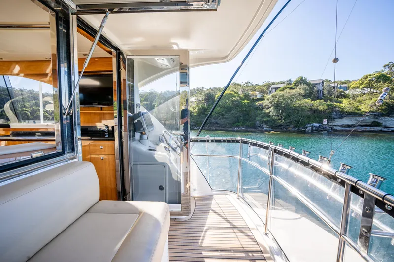 Riviera 61 Enclosed Flybridge Yacht Photos Pics 2011 Riviera 61 Enclosed Flybridge yacht with scenic water view and luxurious interior.