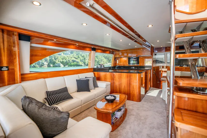 Riviera 61 Enclosed Flybridge Yacht Photos Pics Luxurious interior of 2011 Riviera 61 Enclosed Flybridge yacht with elegant wood finishes.