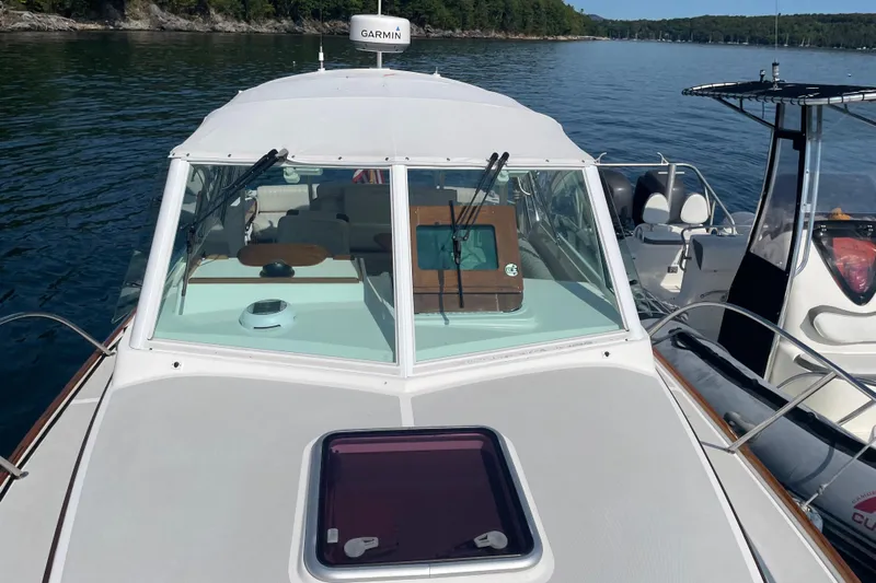 Tenacity Yacht Photos Pics 2012 Hunt Surfhunter boat on calm lake with Garmin equipment.