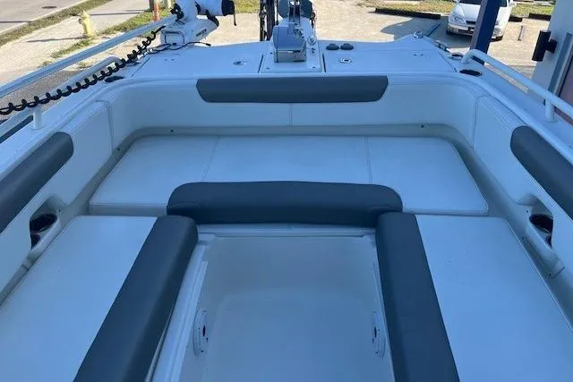  Yacht Photos Pics 2022 World Cat 255 DC boat interior with cushioned seating and storage compartments.