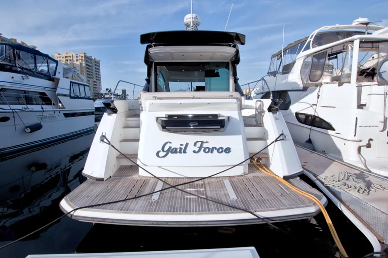 Gail Force Yacht Photos Pics 2019 Beneteau Gran Turismo 50 yacht docked at marina, rear view.
