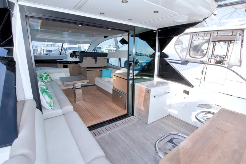 Gail Force Yacht Photos Pics Luxurious interior of 2019 Beneteau Gran Turismo 50 yacht with modern seating and decor.