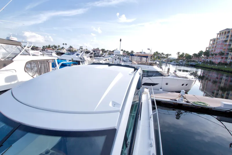 Gail Force Yacht Photos Pics 2019 Beneteau Gran Turismo 50 yacht docked in a marina, surrounded by other boats.