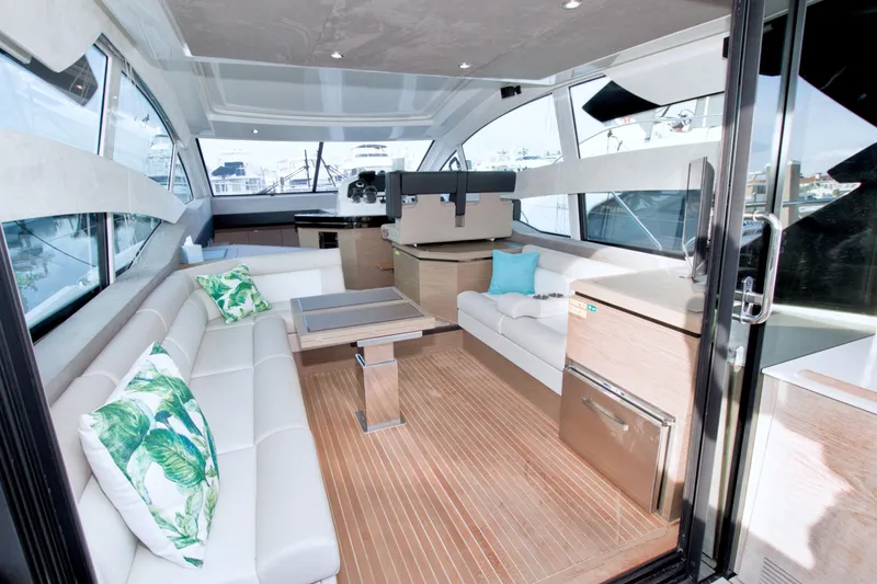 Gail Force Yacht Photos Pics Luxurious interior of 2019 Beneteau Gran Turismo 50 yacht with modern seating and decor.