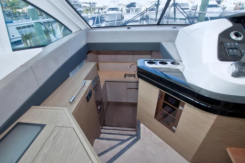 Gail Force Yacht Photos Pics 2019 Beneteau Gran Turismo 50 yacht interior with modern kitchen and control panel.