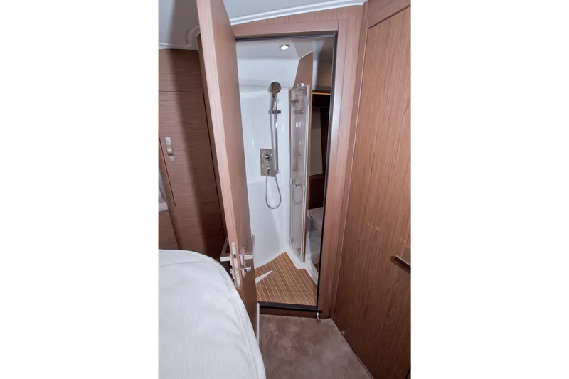 Gail Force Yacht Photos Pics 2019 Beneteau Gran Turismo 50 yacht interior with modern shower and wooden accents.