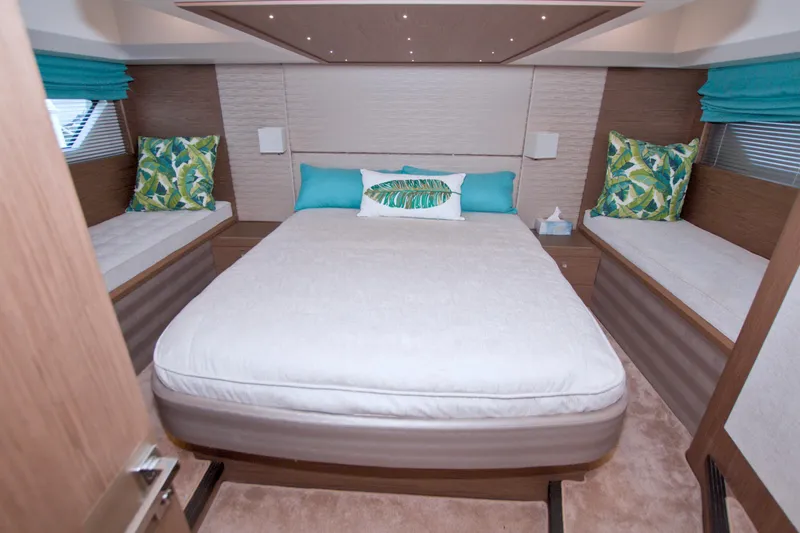 Gail Force Yacht Photos Pics Luxurious bedroom interior of 2019 Beneteau Gran Turismo 50 yacht with modern decor.