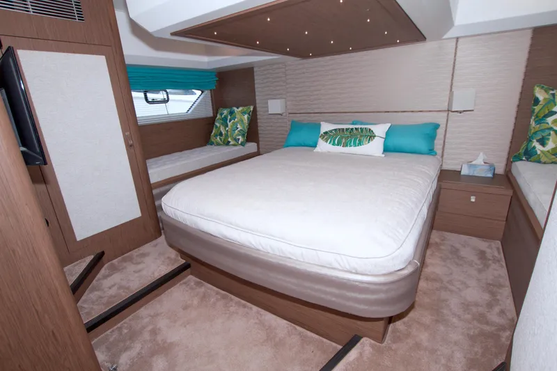 Gail Force Yacht Photos Pics Luxurious bedroom interior of 2019 Beneteau Gran Turismo 50 yacht with modern decor.
