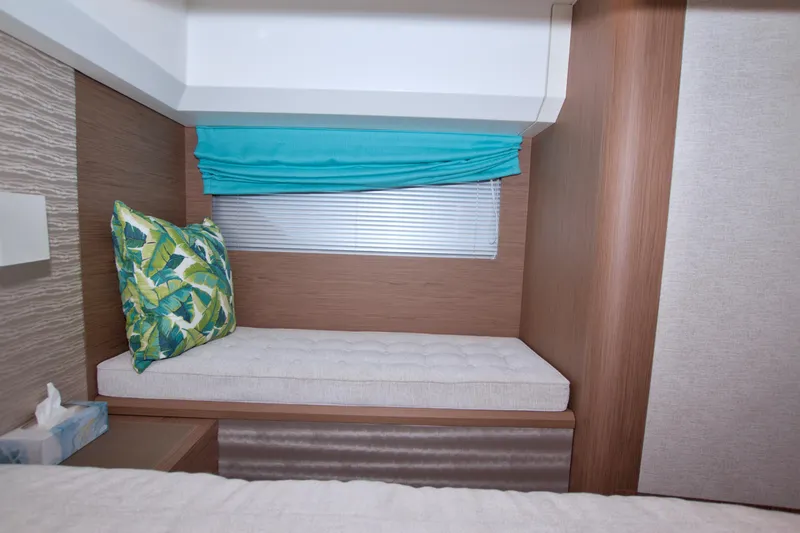 Gail Force Yacht Photos Pics 2019 Beneteau Gran Turismo 50 interior with cushioned seating and tropical pillow.