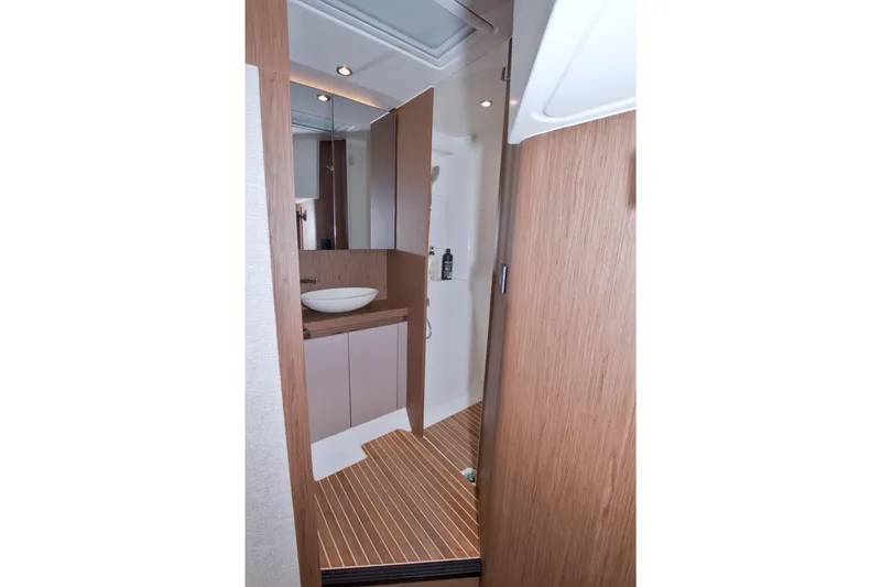 Gail Force Yacht Photos Pics 2019 Beneteau Gran Turismo 50 bathroom with modern wood finish and vessel sink.