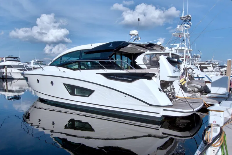 Gail Force Yacht Photos Pics 2019 Beneteau Gran Turismo 50 yacht docked at marina under blue sky.