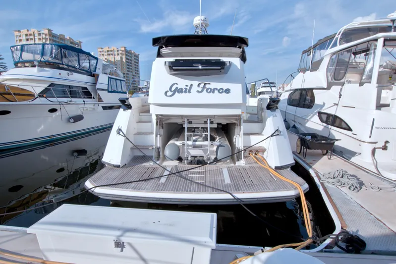 Gail Force Yacht Photos Pics 2019 Beneteau Gran Turismo 50 yacht docked at marina, rear view.