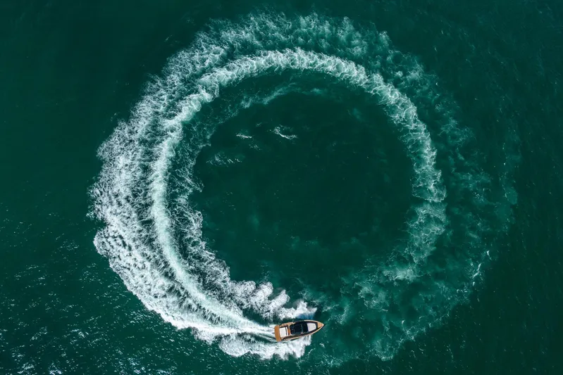 Morgan 1 Yacht Photos Pics Aerial view of 2023 Pardo Yachts 43 creating circular wake in the ocean.