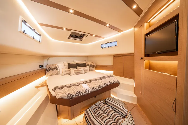 Morgan 1 Yacht Photos Pics Luxurious interior of 2023 Pardo Yachts 43, featuring a cozy bedroom with modern amenities.