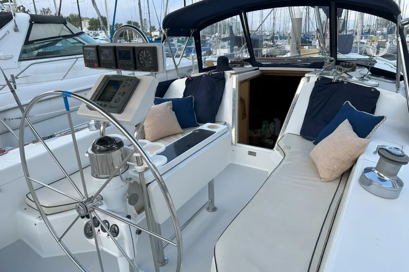 Take Five Yacht Photos Pics Cockpit of 1999 Catalina 42 MkII sailboat with steering wheel and navigation instruments.