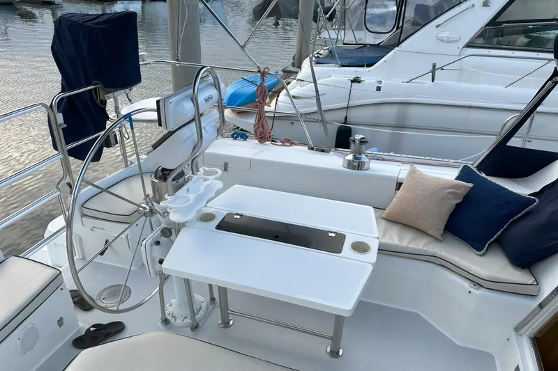 Take Five Yacht Photos Pics Cockpit of 1999 Catalina 42 MkII sailboat with steering wheel and seating area.