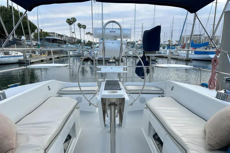 Take Five Yacht Photos Pics Cockpit view of a 1999 Catalina 42 MkII sailboat docked in a marina.