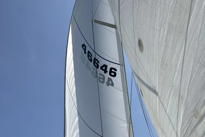 Take Five Yacht Photos Pics Sails of a 1999 Catalina 42 MkII yacht against a clear blue sky.