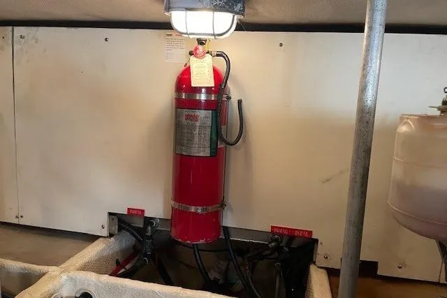 Perseus Yacht Photos Pics Fire extinguisher in 2008 Mainship 34 Trawler Hardtop engine room.