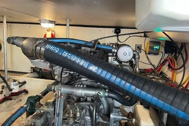 Perseus Yacht Photos Pics Engine room of 2008 Mainship 34 Trawler Hardtop, showcasing mechanical components and wiring.