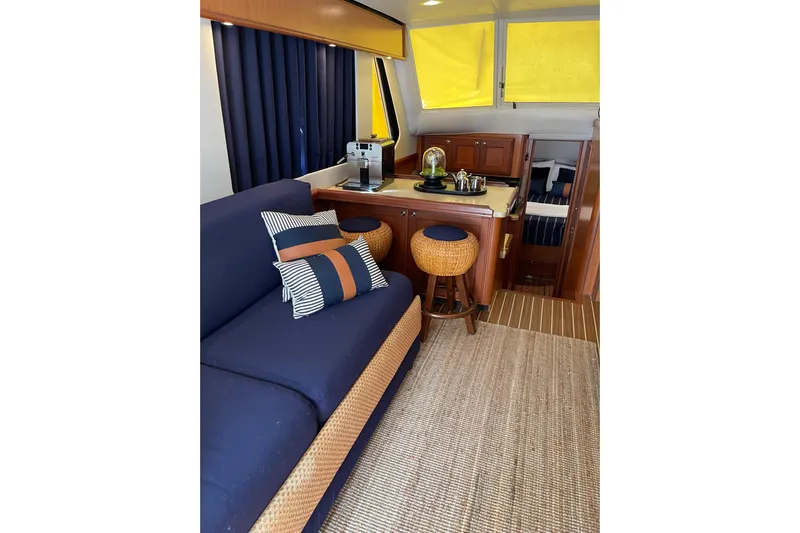 Perseus Yacht Photos Pics Interior of 2008 Mainship 34 Trawler Hardtop with cozy seating and kitchenette.