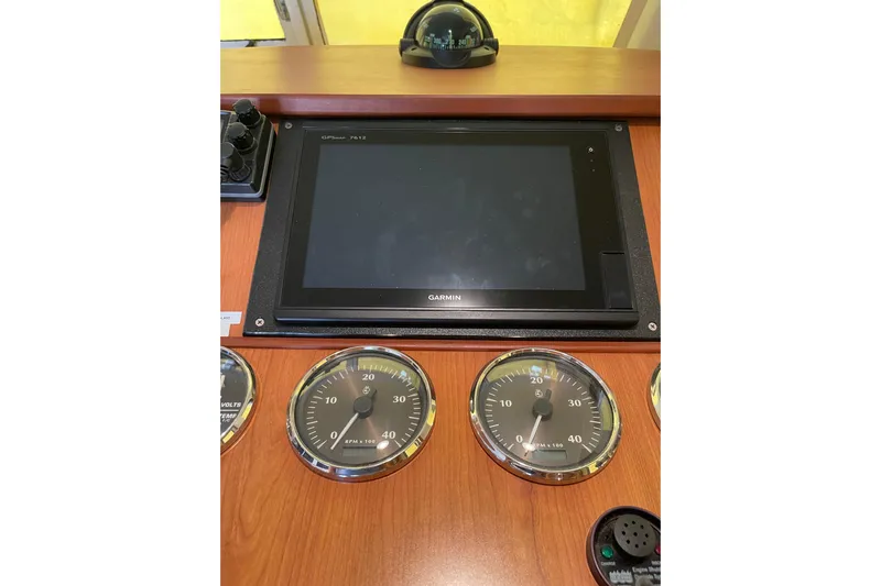 Perseus Yacht Photos Pics 2008 Mainship 34 Trawler Hardtop dashboard with Garmin display and gauges.