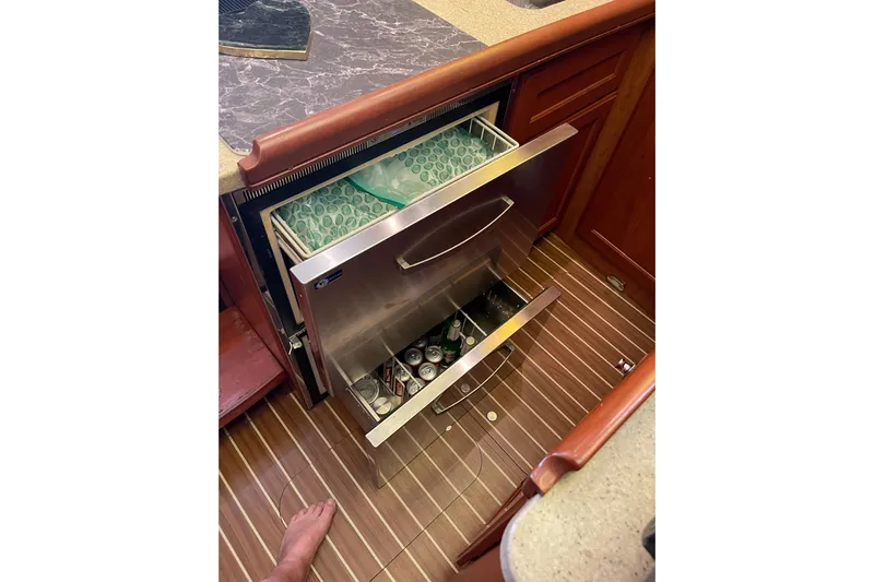 Perseus Yacht Photos Pics 2008 Mainship 34 Trawler Hardtop kitchen with open stainless steel drawer fridge.