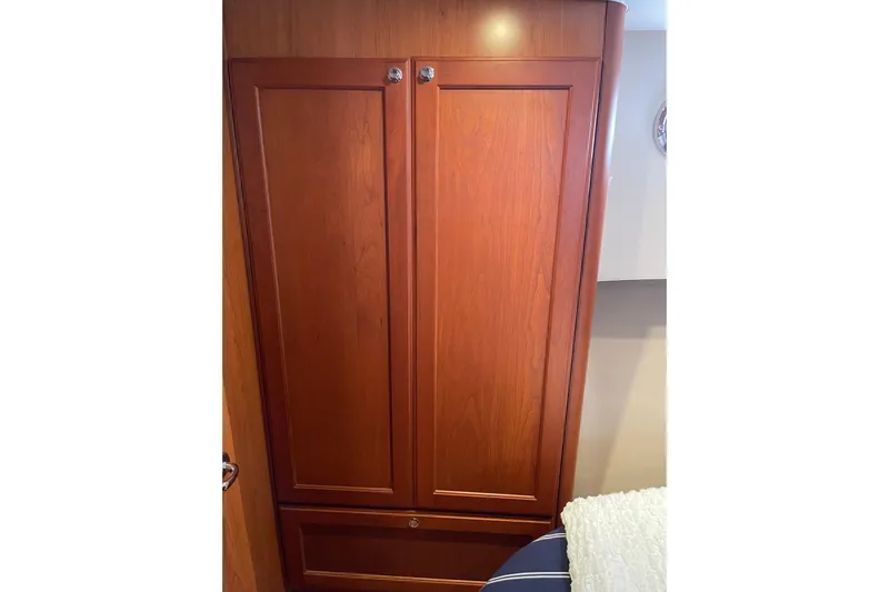 Perseus Yacht Photos Pics Wooden cabinet inside 2008 Mainship 34 Trawler Hardtop boat interior.