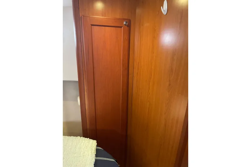 Perseus Yacht Photos Pics 2008 Mainship 34 Trawler Hardtop interior with wooden cabinetry and cozy design.