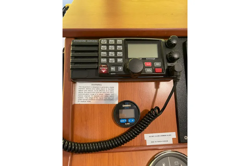 Perseus Yacht Photos Pics VHF radio and controls on 2008 Mainship 34 Trawler Hardtop dashboard.