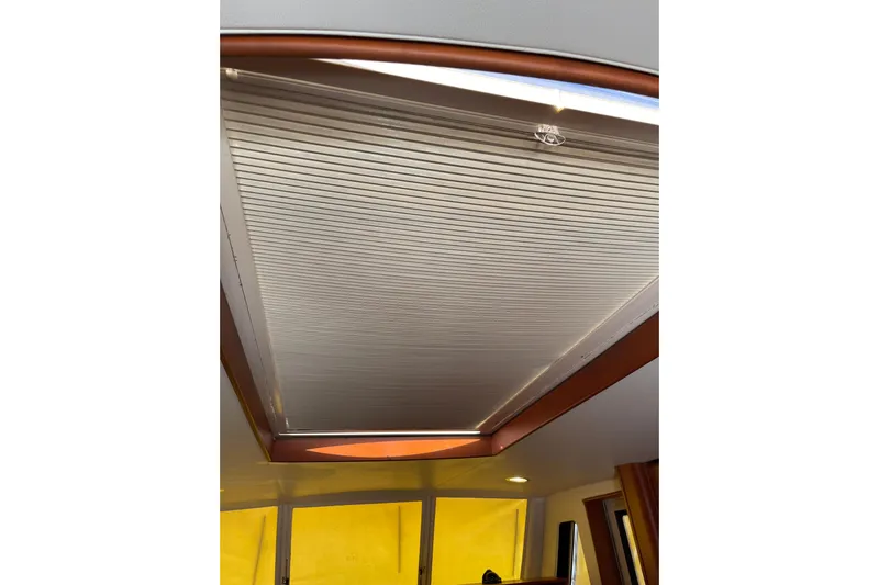 Perseus Yacht Photos Pics 2008 Mainship 34 Trawler Hardtop interior ceiling with wooden trim and lighting.