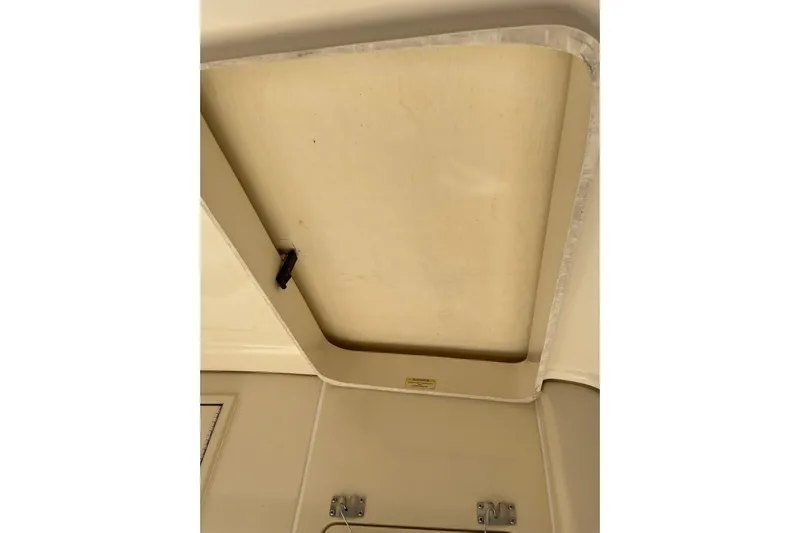 Perseus Yacht Photos Pics 2008 Mainship 34 Trawler Hardtop interior ceiling detail with hatch and latch.