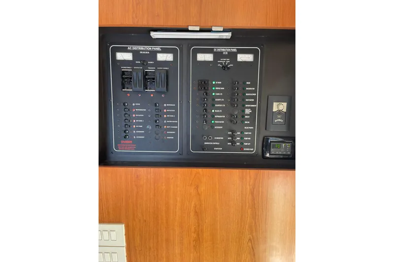 Perseus Yacht Photos Pics Electrical control panel on 2008 Mainship 34 Trawler Hardtop, featuring AC and DC distribution.